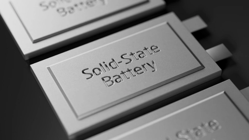 Close-up angled view of metallic battery cells embossed with the words Solid-State Battery in a row
