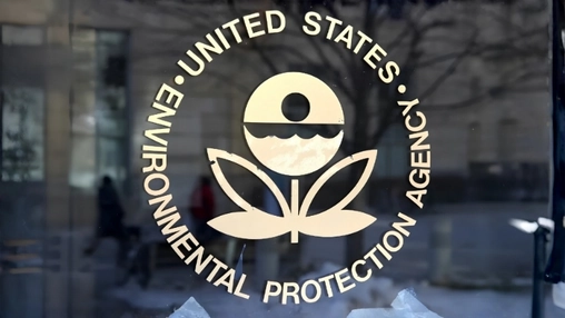 The Environmental Protection Agency seal displayed on a glass entrance door